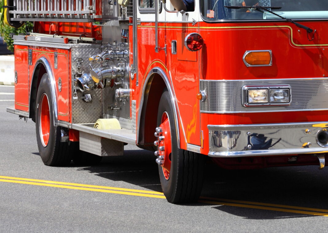 fire truck arrives to scene of building fire