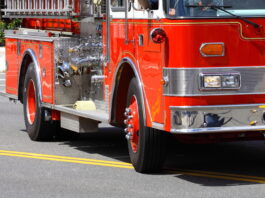 fire truck arrives to scene of building fire
