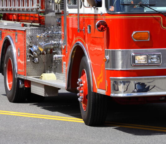 fire truck arrives to scene of building fire