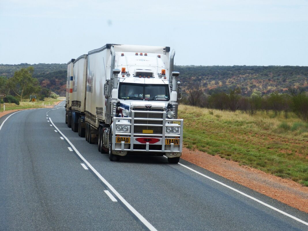 semitruck depicted driving on highway