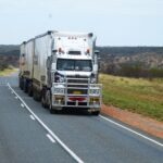 semitruck depicted driving on highway