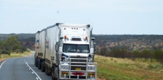 semitruck depicted driving on highway