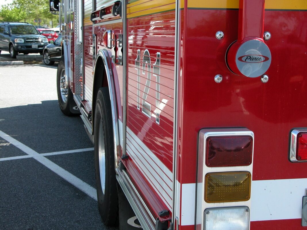 fire engine assists at scene of house fire