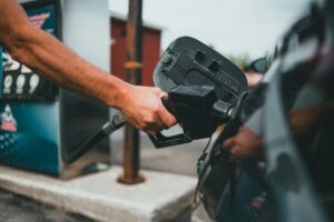 Car Involved In A Collision Topples Gas Pump, Trapping A Customer Underneath