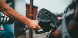 Car Involved In A Collision Topples Gas Pump, Trapping A Customer Underneath