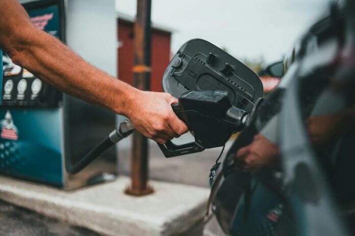 Car Involved In A Collision Topples Gas Pump, Trapping A Customer Underneath