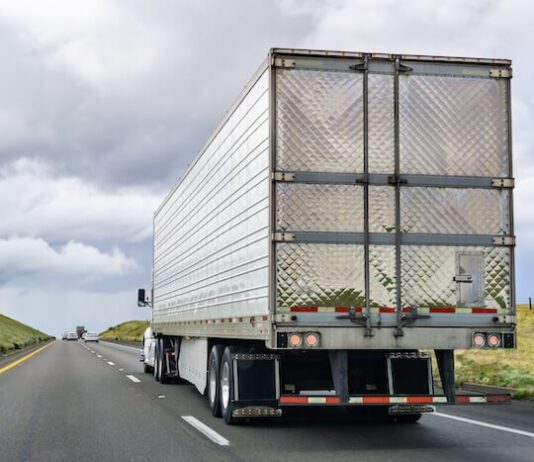 Driver Hospitalized After Being Pinned Between Two Semi-trucks in Crash